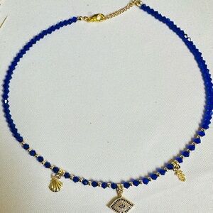 Blue and Gold Beaded Necklace with Evil Eye and Charms